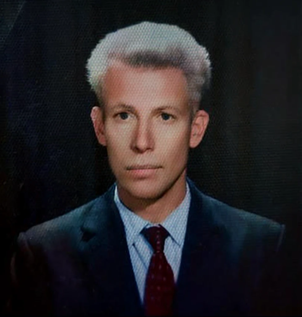 a close up of a man in a suit and tie on a television screen, professional picture, photo of a 50-year-old white man, around 1 9 years old, portrait of a man in a suit, professional closeup photo, funny professional photo, photo of a man, professional profile photo, color portrait, amazing professional picture, a photo of a man