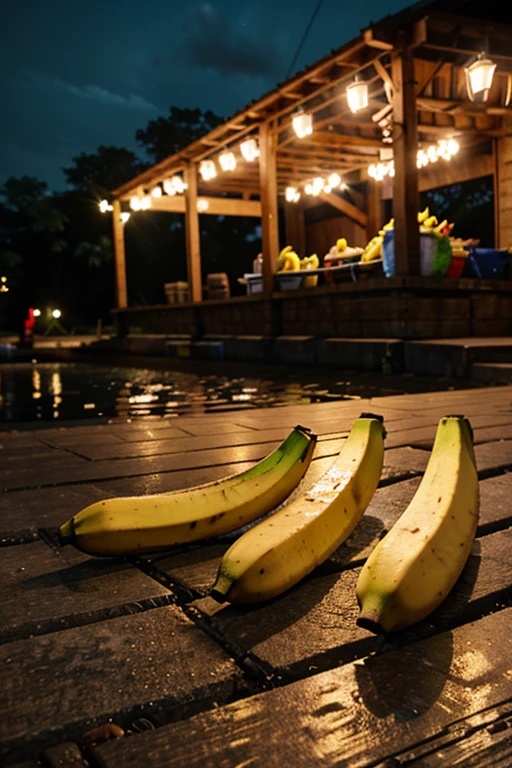 a bunch of bananas left in the ground in a dock at night