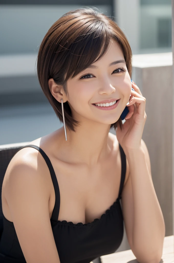 A beautiful woman with short hair smiles while talking on the phone