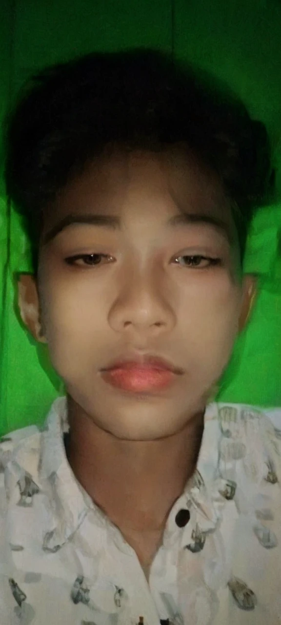Realistic photos of (1 Cute Korean Male Celebrities) at eye level, sitting in front of a window with a coat on, a cigarette dangling from his fingers, and dim lights surrounding the scene. The clear facial features are showcased in crisp, lifelike details, making it an 8K high resolution masterpiece. Taken with an F/4.0 aperture and 135 mm lens on a FujiFilm camera, the jpeg artifacts and slight jitter add to the raw, authentic feel of the image. Ultra HD quality adds to the overall beauty and realism of this photorealistic portrait.
