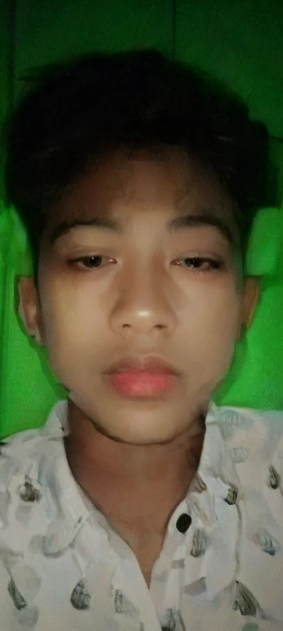Realistic photos of (1 Cute Korean Male Celebrities) at eye level, sitting in front of a window with a coat on, a cigarette dangling from his fingers, and dim lights surrounding the scene. The clear facial features are showcased in crisp, lifelike details, making it an 8K high resolution masterpiece. Taken with an F/4.0 aperture and 135 mm lens on a FujiFilm camera, the jpeg artifacts and slight jitter add to the raw, authentic feel of the image. Ultra HD quality adds to the overall beauty and realism of this photorealistic portrait.