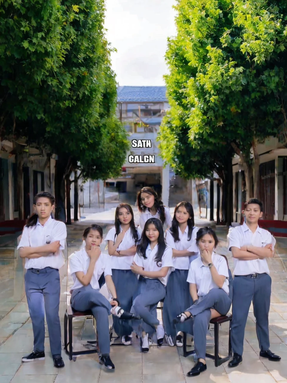 Four Indonesian women one sitting and three standing are posing for a group photo of three young Indonesian men posing with two men sitting and two men standing on the left and right sides, they are all wearing white uniforms and gray gray bottoms, in a school yard, realistic photography, cinematic photography, aestetic photography, wide angle, super detail, a very extraordinary masterpiece,  16K image quality