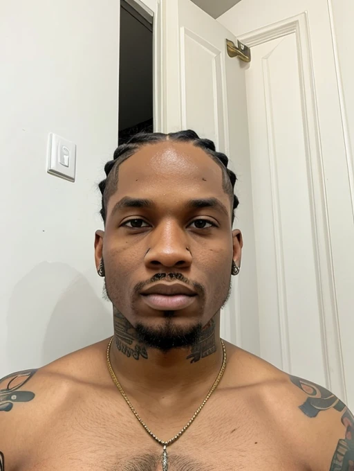 A black gang member with cornrows and tattoos 