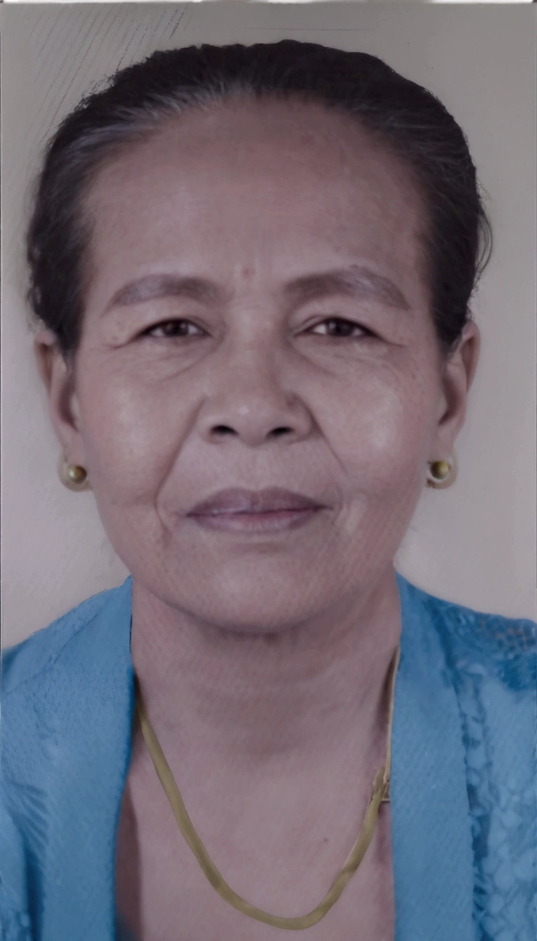 there is a woman with a necklace on her neck and a blue shirt, photo of a woman, taken in the early 2020s, portrait 6 0 - year - old woman, 60 year old woman wearing traditional Balinese kebaya, black earrings, gold necklace