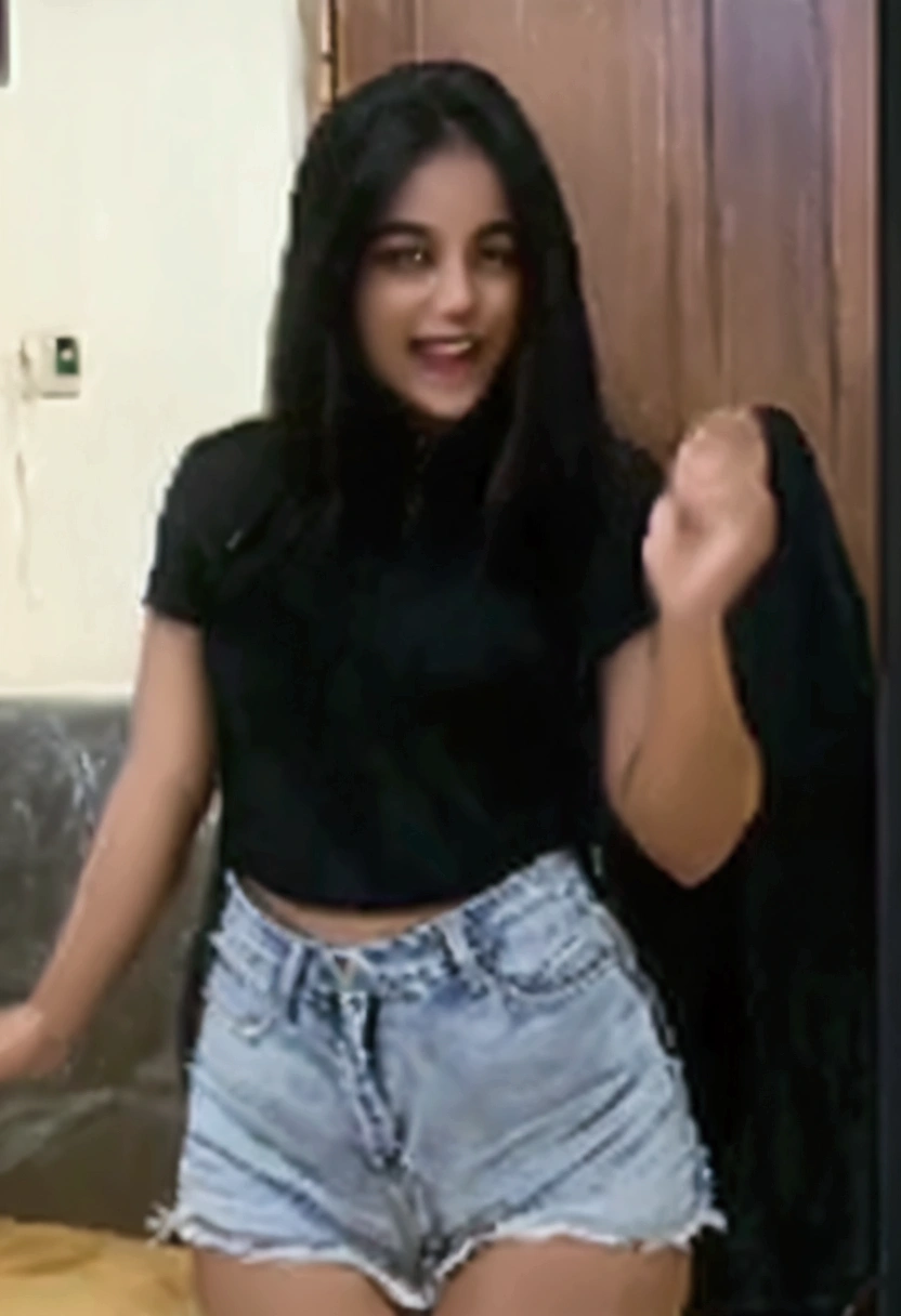 there is a woman in a black top and blue shorts, she is dancing, tiktok video, she is dancing. realistic, young and cute girl, sexy girl, wearing jeans and a black hoodie, cute girl, with funny feeling, black quick, attractive girl, she expressing joy, cute woman, new song, excited, indian, with a black background