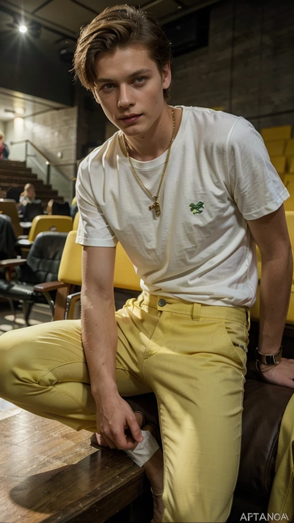 Janis Ancens, preppy haircut, classic pants, green t-shirt and yellow pants, elegant watch, smile, sitting in the cinema, full view