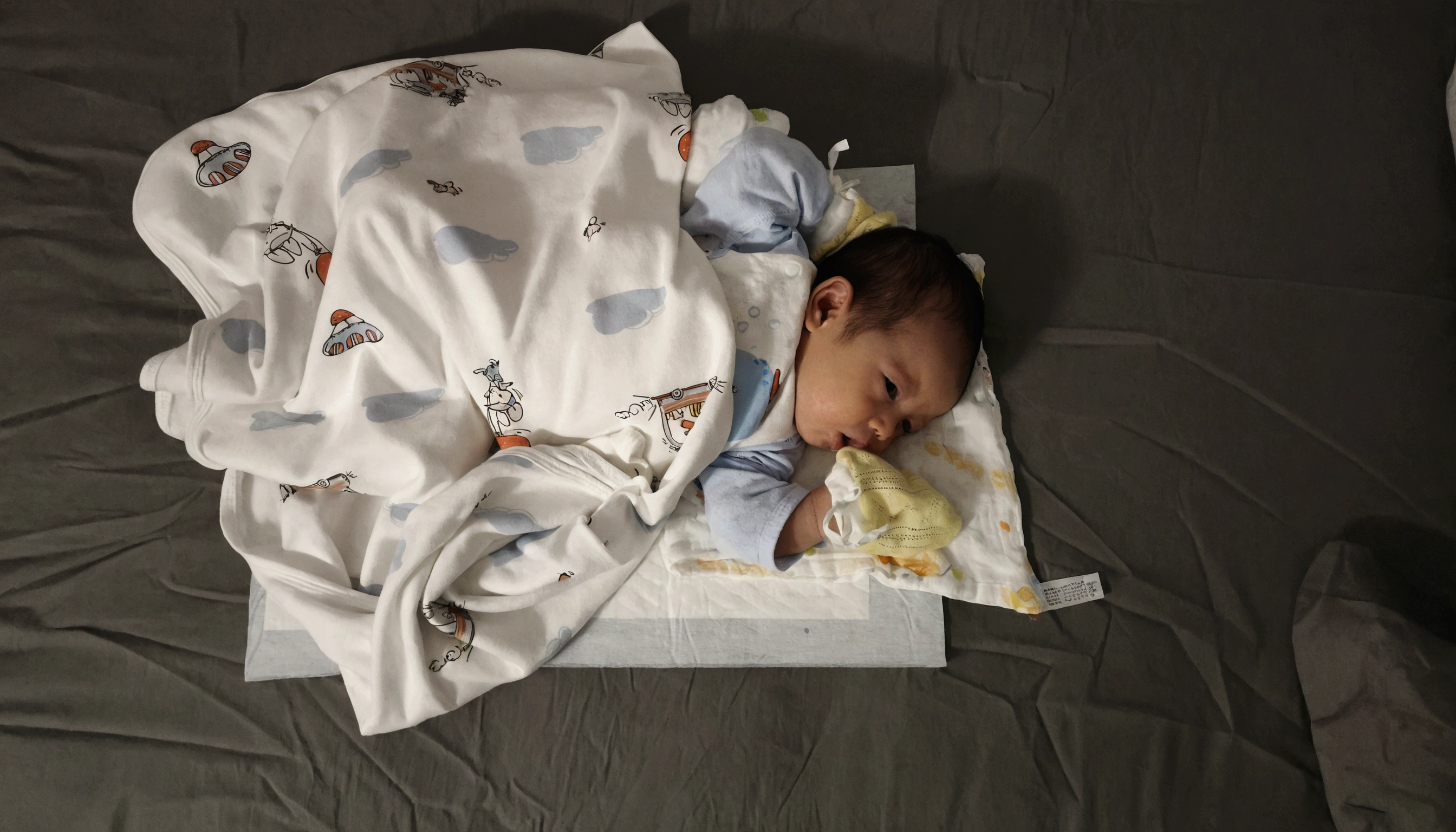 there is a baby Sleep on a bed with a blanket, faint, rest on a tough day, rest, abcdefghijklmnopqrstuvwxyz, Almost dozing off, Inspired by Federico Barrocchi, rest after a hard fight, There's a full potty next to it, rest on a pillow, Sleep, Lying in bed,(Baby Boy:1.9)