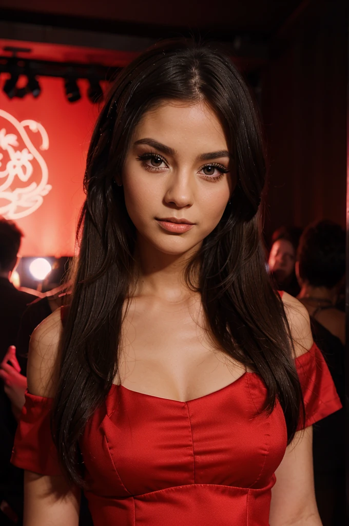 Cute girl with makeup in red dress in a nightclub