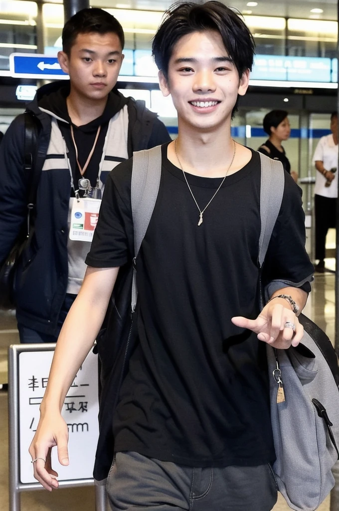 An Indonesian Malaysian boy has a big smile on his face, while standing at the airport and being photographed by paparazzi. He has a modern clothing style, black hair, world, yes also well styled he has dimples he is tall and waves short hair