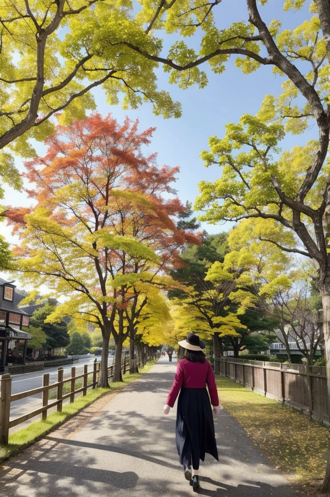 A promenade lined with colorful maple and ginkgo trees　A strolling woman　Beautiful and slender in her 30s　