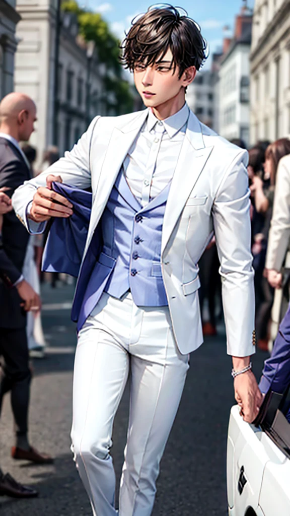 boy at an event in an elegant white suit 