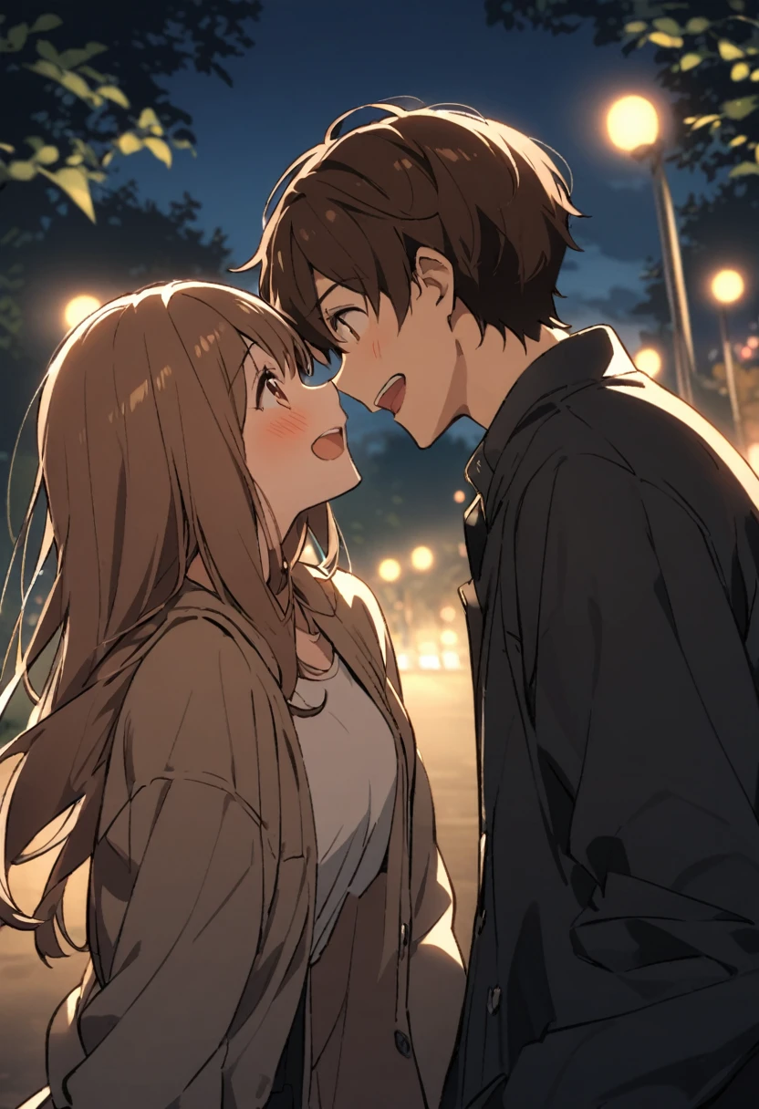 A couple looking at each other and laughing in a park at night、Woman has long brown hair