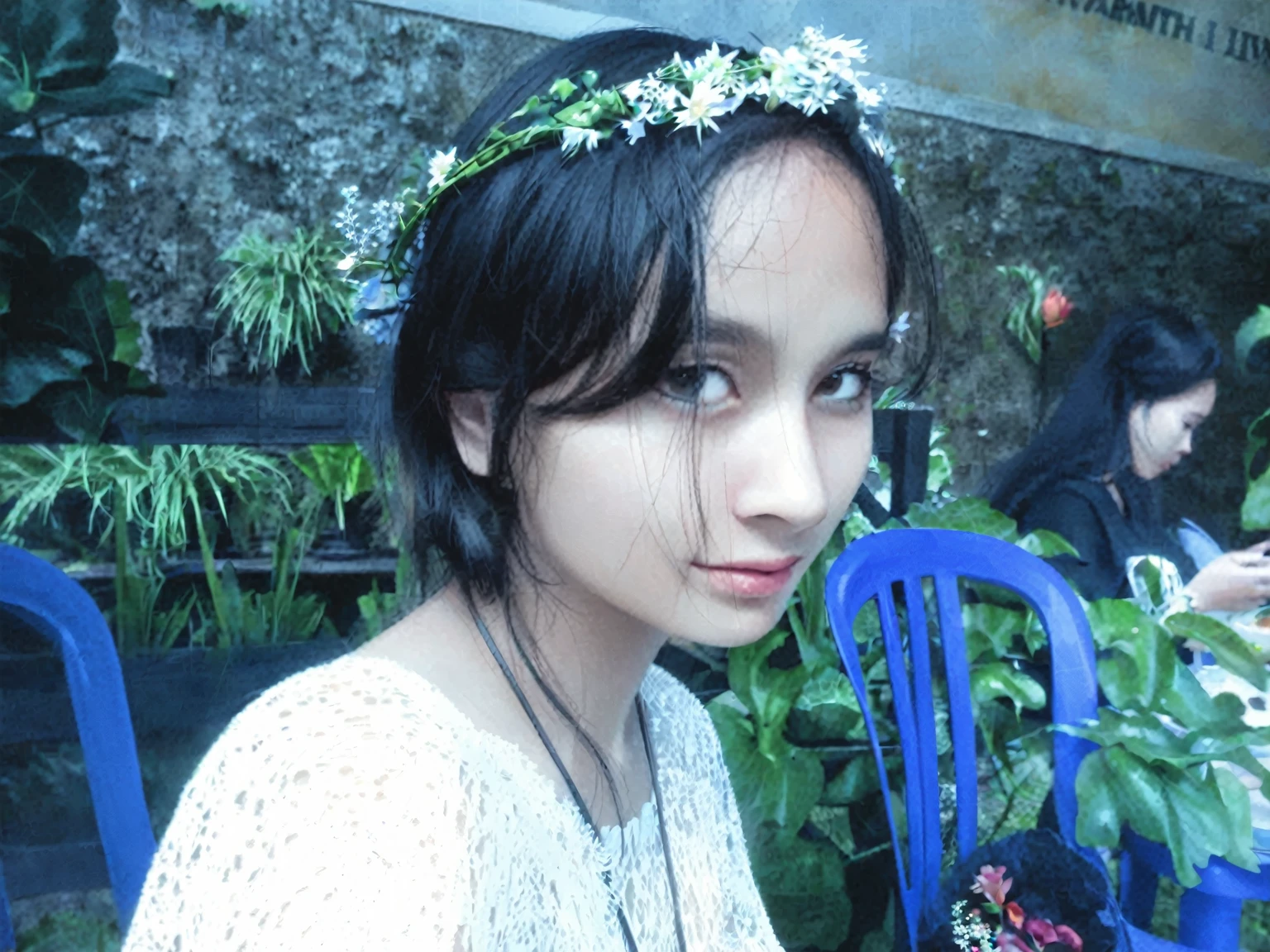 there is a woman sitting at a table with a plate of food, wearing a flower headpiece, wearing a floral crown, she has a crown of flowers, with flowers, she has a crown of dried flowers, wearing a crown of vines, wearing angel halo, flower crown, nivanh chanthara, lotus floral crown girl, with ivy, in garden