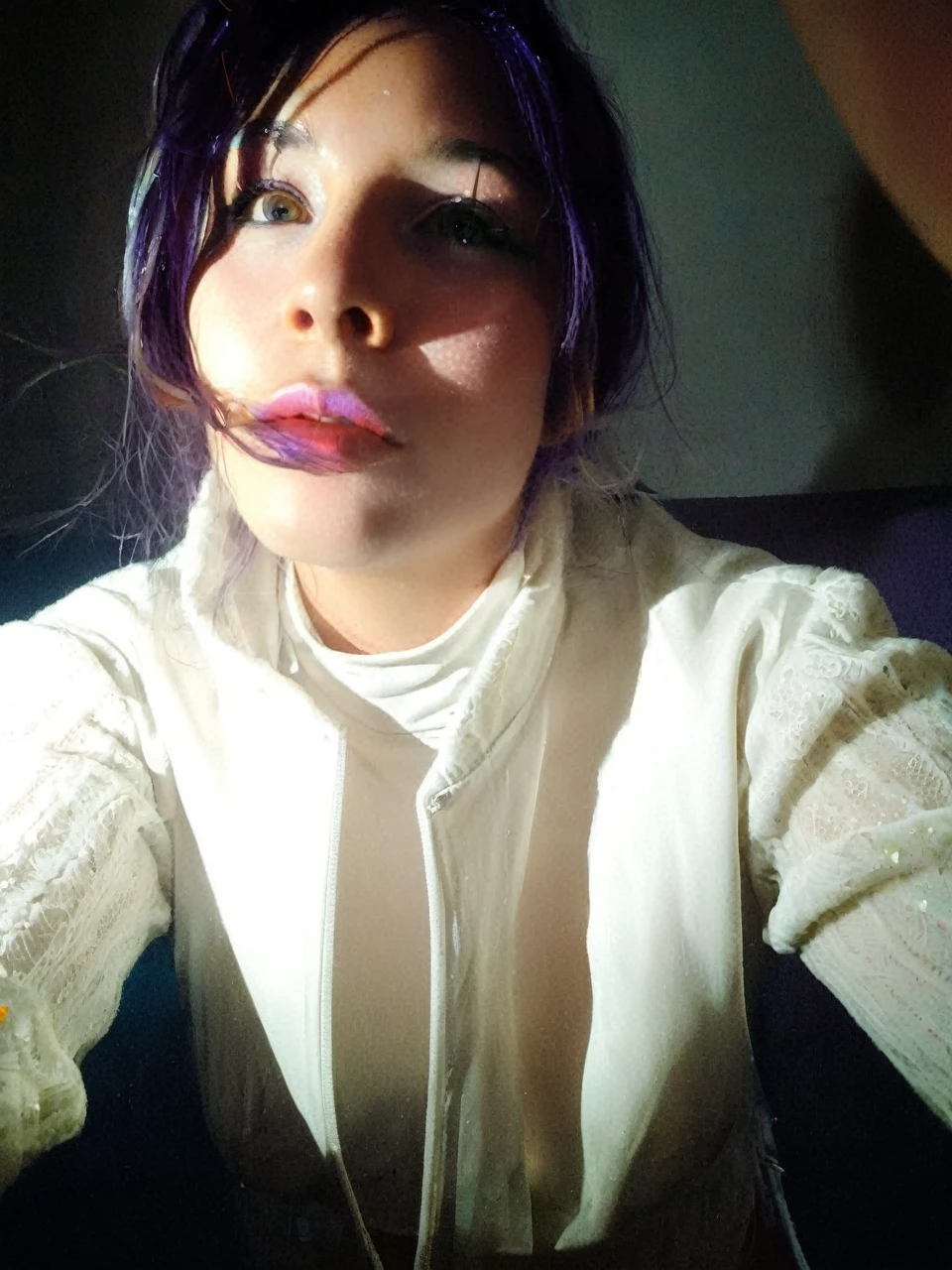 Frontal portrait of an extravagant and colorful woman who resembles a mermaid. Perfect body, natural breasts, clear skin, young features, wide open eyes and delicate freckles on the nose and cheeks. Front view, Vibrant, gravity-defying hair in shades of purple, blue and orange. Her hair transforms into tendrils or aquatic flora, creating an underwater illusion. Small bubbles floating around the head add to the underwater theme. General Effect: Serene otherworldly underwater creature in silent contemplation.