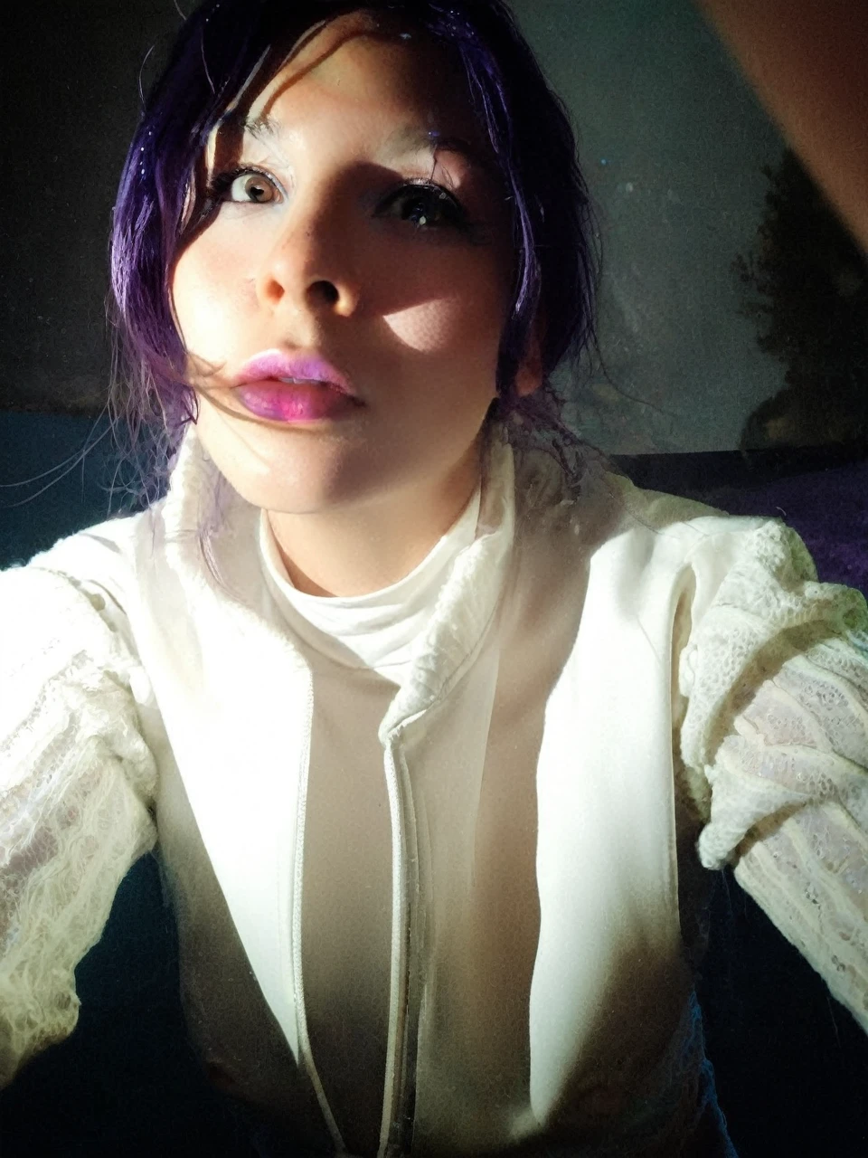 Frontal portrait of an extravagant and colorful woman who resembles a mermaid. Perfect body, natural breasts, clear skin, young features, wide open eyes and delicate freckles on the nose and cheeks. Front view, Vibrant, gravity-defying hair in shades of purple, blue and orange. Her hair transforms into tendrils or aquatic flora, creating an underwater illusion. Small bubbles floating around the head add to the underwater theme. General Effect: Serene otherworldly underwater creature in silent contemplation.