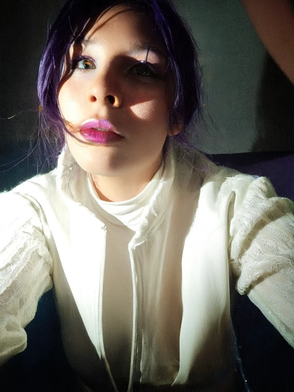 Frontal portrait of an extravagant and colorful woman who resembles a mermaid. Perfect body, natural breasts, clear skin, young features, wide open eyes and delicate freckles on the nose and cheeks. Front view, Vibrant, gravity-defying hair in shades of purple, blue and orange. Her hair transforms into tendrils or aquatic flora, creating an underwater illusion. Small bubbles floating around the head add to the underwater theme. General Effect: Serene otherworldly underwater creature in silent contemplation.