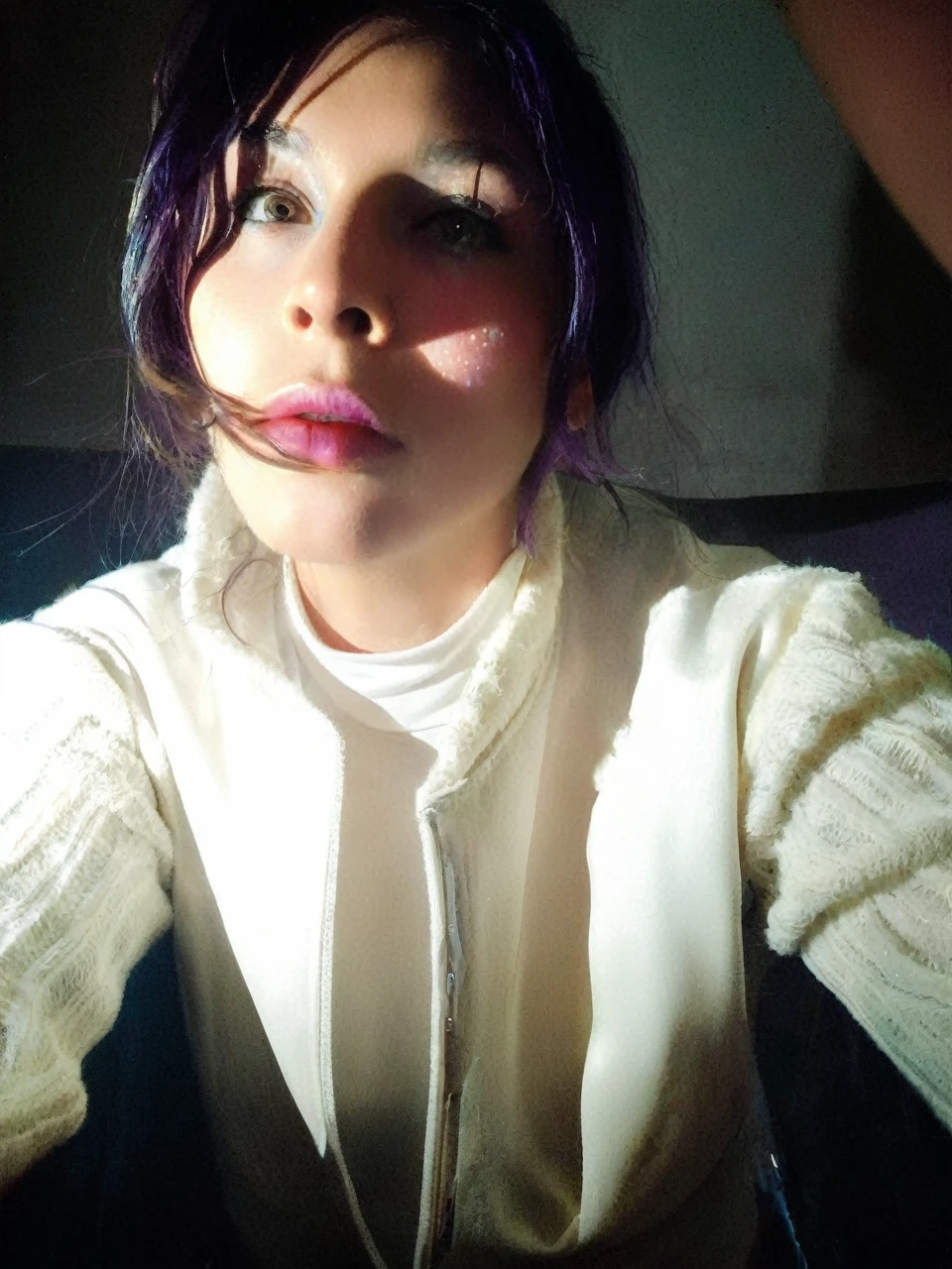 Frontal portrait of an extravagant and colorful woman who resembles a mermaid. Perfect body, natural breasts, clear skin, young features, wide open eyes and delicate freckles on the nose and cheeks. Front view, Vibrant, gravity-defying hair in shades of purple, blue and orange. Her hair transforms into tendrils or aquatic flora, creating an underwater illusion. Small bubbles floating around the head add to the underwater theme. General Effect: Serene otherworldly underwater creature in silent contemplation.
