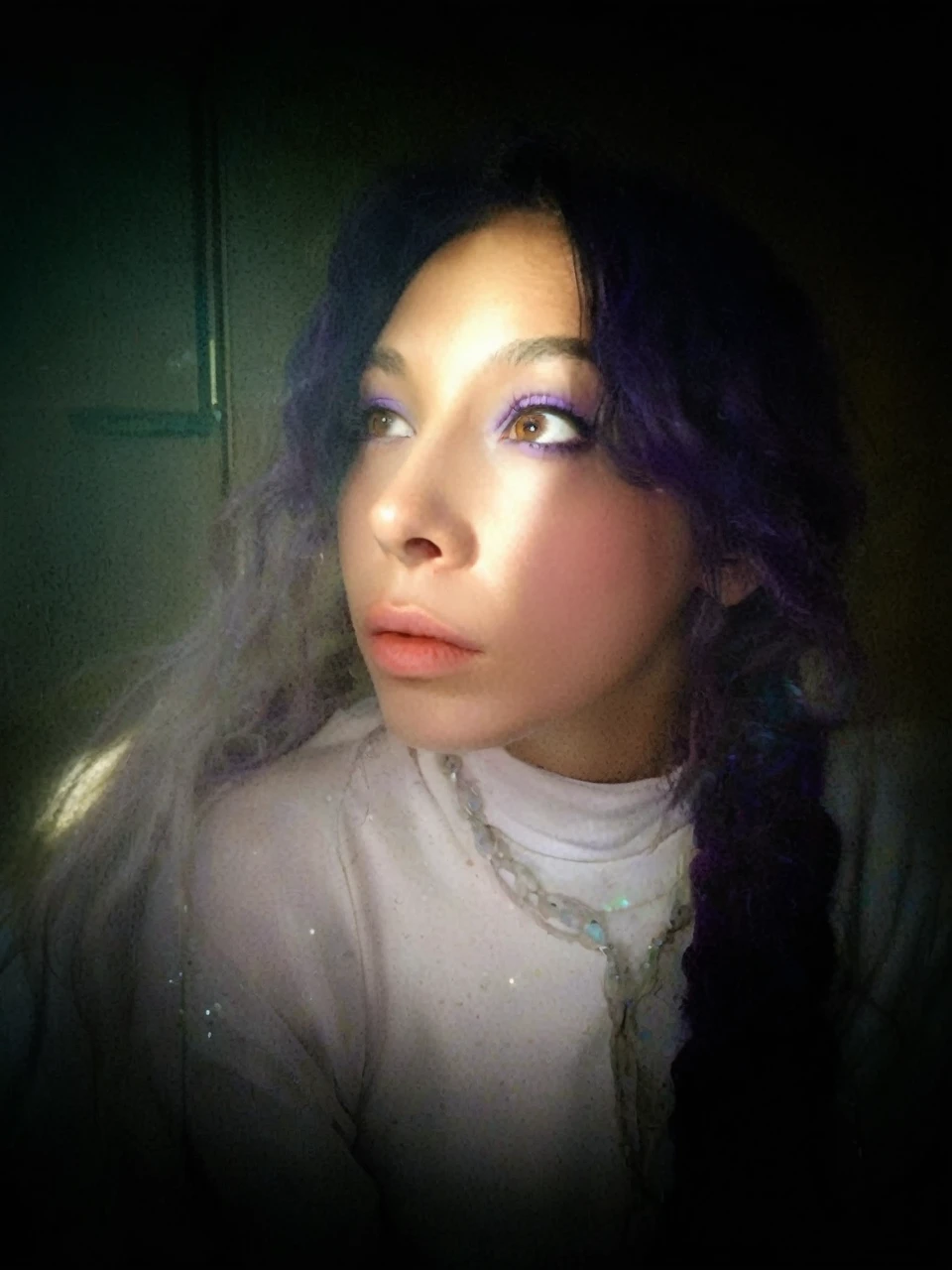 Frontal portrait of an extravagant and colorful woman who resembles a mermaid. Perfect body, natural breasts, clear skin, young features, wide open eyes and delicate freckles on the nose and cheeks. Front view, Vibrant, gravity-defying hair in shades of purple, blue and orange. Her hair transforms into tendrils or aquatic flora, creating an underwater illusion. Small bubbles floating around the head add to the underwater theme. General Effect: Serene otherworldly underwater creature in silent contemplation.