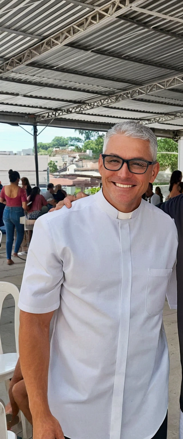 A tall man, strong body, smiling, black glasses, no beard, short gray hair, wearing a priest's outfit and on a white background