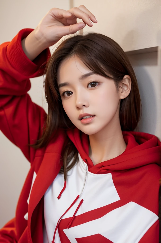 Brown hair that is slightly bouncy and reaches down to the neck,Red hoodie,White shirt,