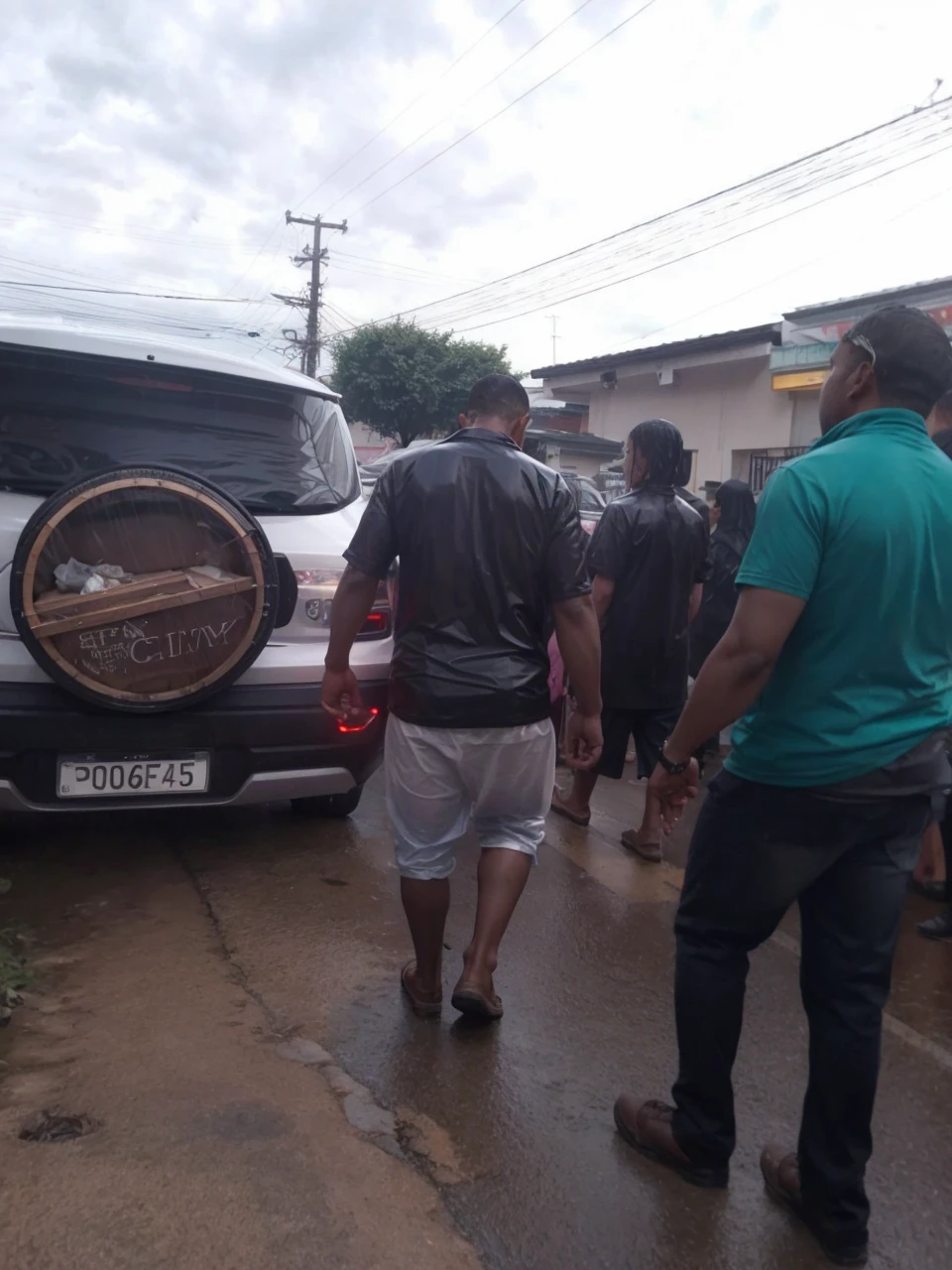People walking with a coffin to the cemetery in the rain