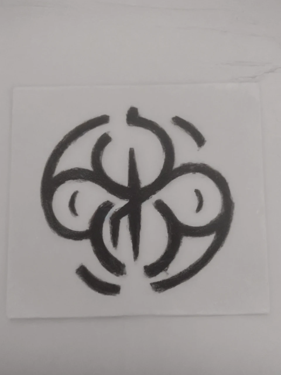 A black symbol with a white background