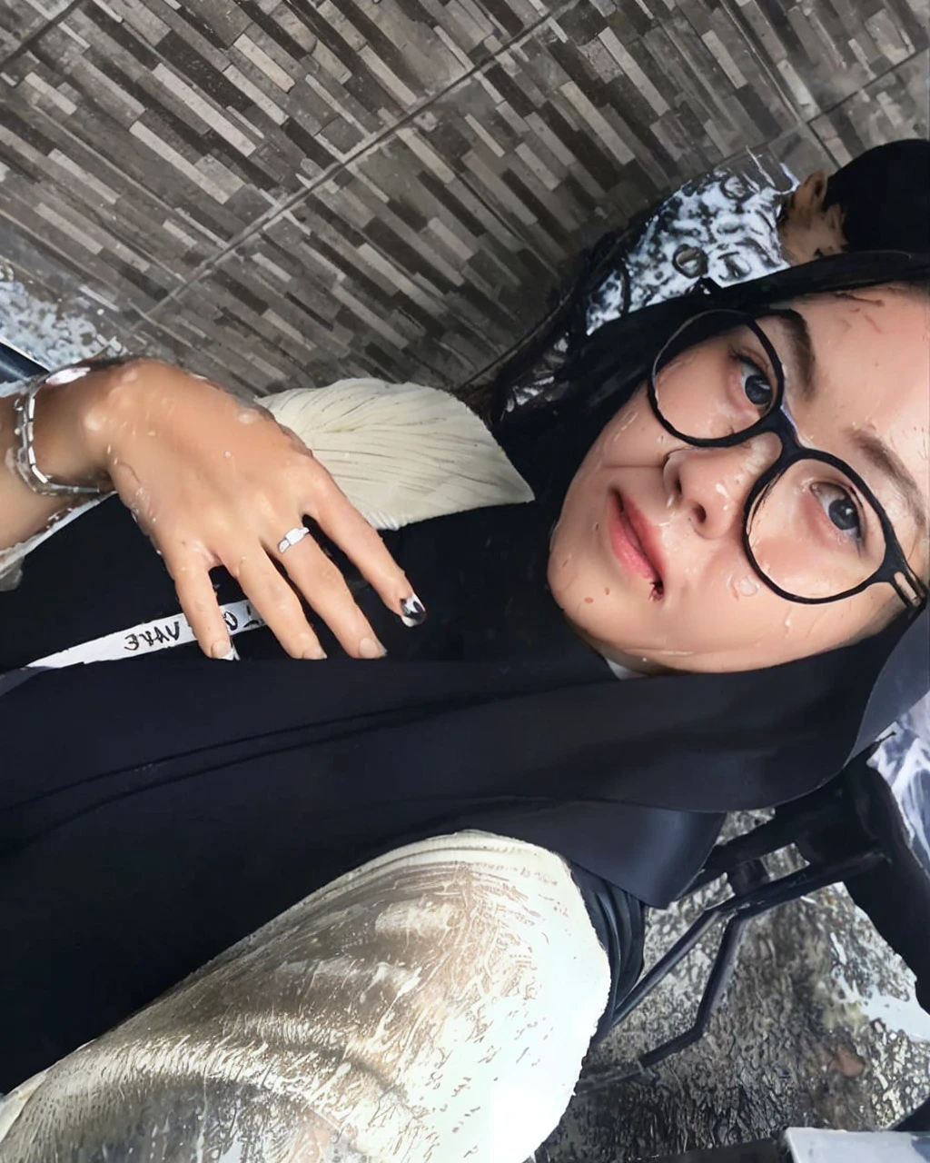 (Best quality, ultra-detailed, 8k, high resolution, masterpiece:1.2), beautiful girl wearing a white button-down shirt, caught in the rain, happy expression, (wet hair:1.5), glossy raindrops on her face, shining wet hair, (refreshed, rejuvenated:0.8), smiling despite the rain, holding a partially open umbrella, rainwater droplets on the umbrella, (splashing puddles on the ground:0.5), (bright colors:0.7), light blue and red hues in the background from the rain, (sharp focus on her face:1.2), bright lighting