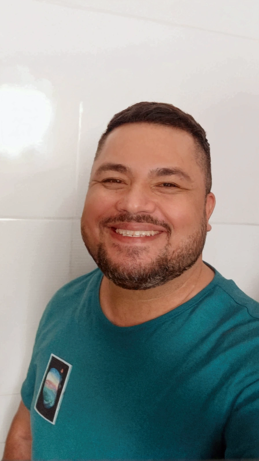 37-year-old man, with a well-trimmed, detailed beard, a little fat and smiling, wearing medium-thick black glasses with transparent lenses