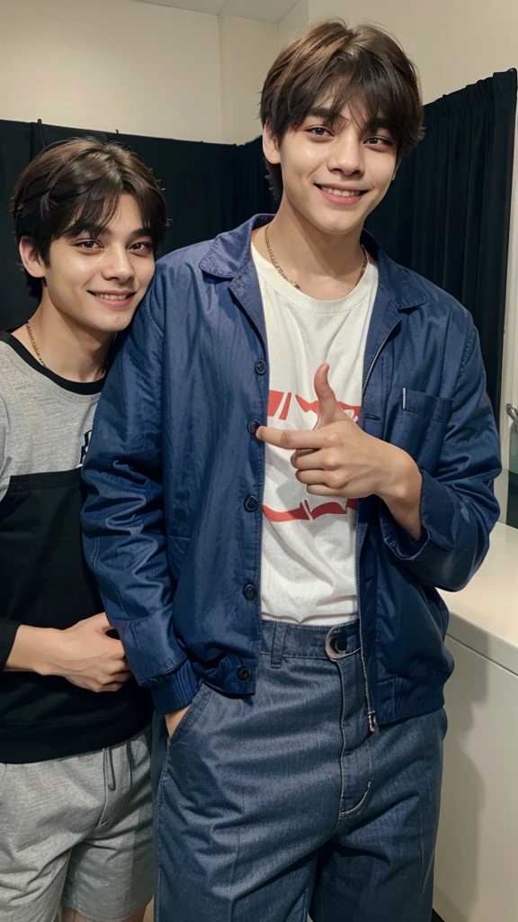Taehyung holding a phone in his hand while pointing at it with a smile. And behind him is Jungkook, smiling, while making a sign to remain silent.