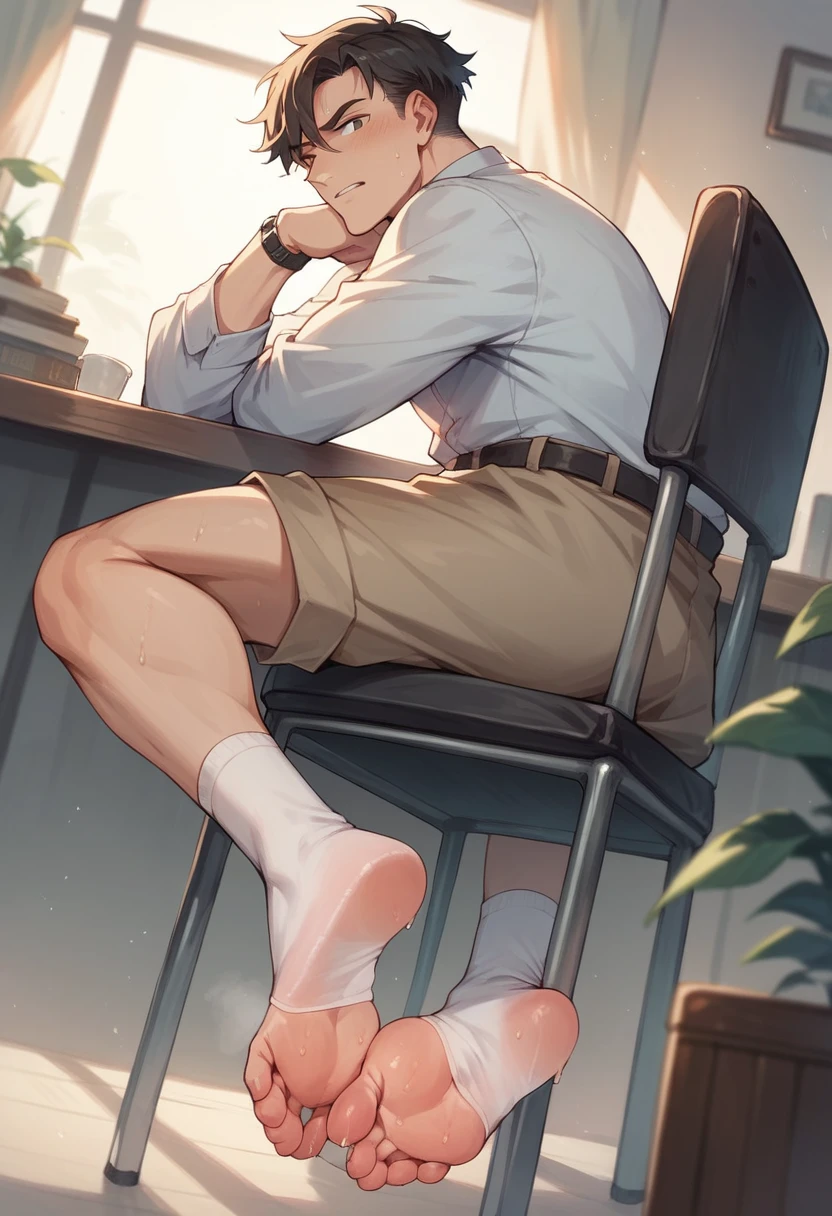 Boy showing the soles of his feet while scrunching his sweaty soles in white socks sitting on chair