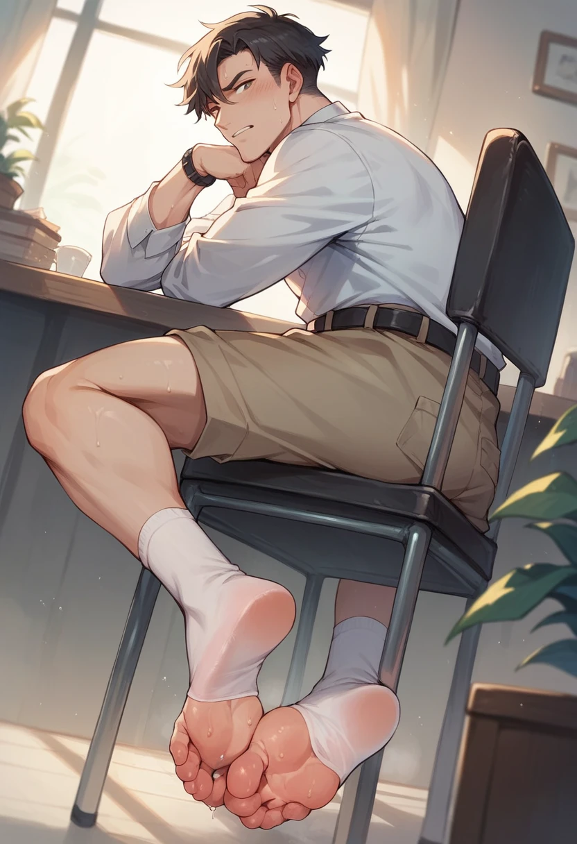 Boy showing the soles of his feet while scrunching his sweaty soles in white socks sitting on chair