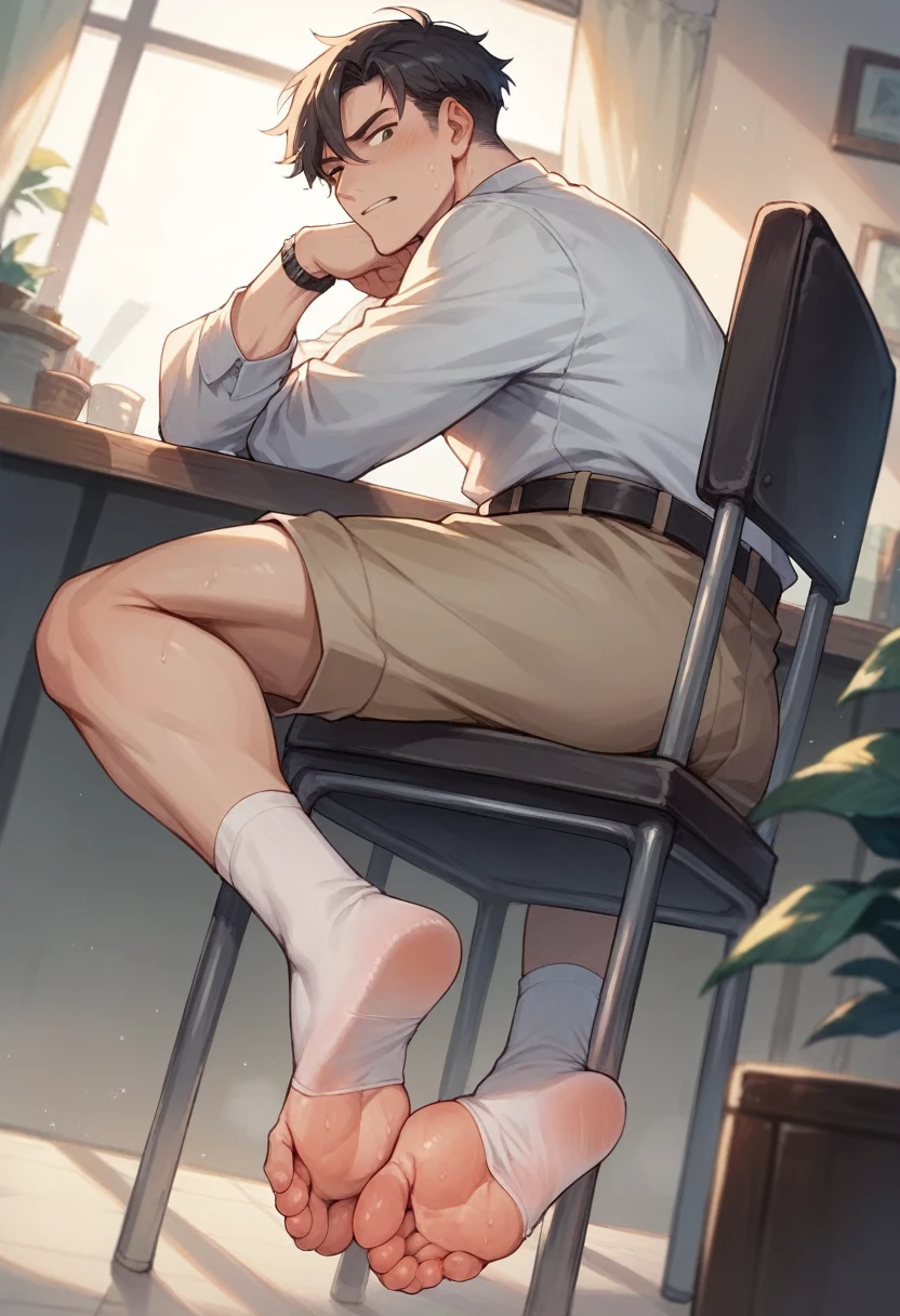 Boy showing the soles of his feet while scrunching his sweaty soles in white socks sitting on chair