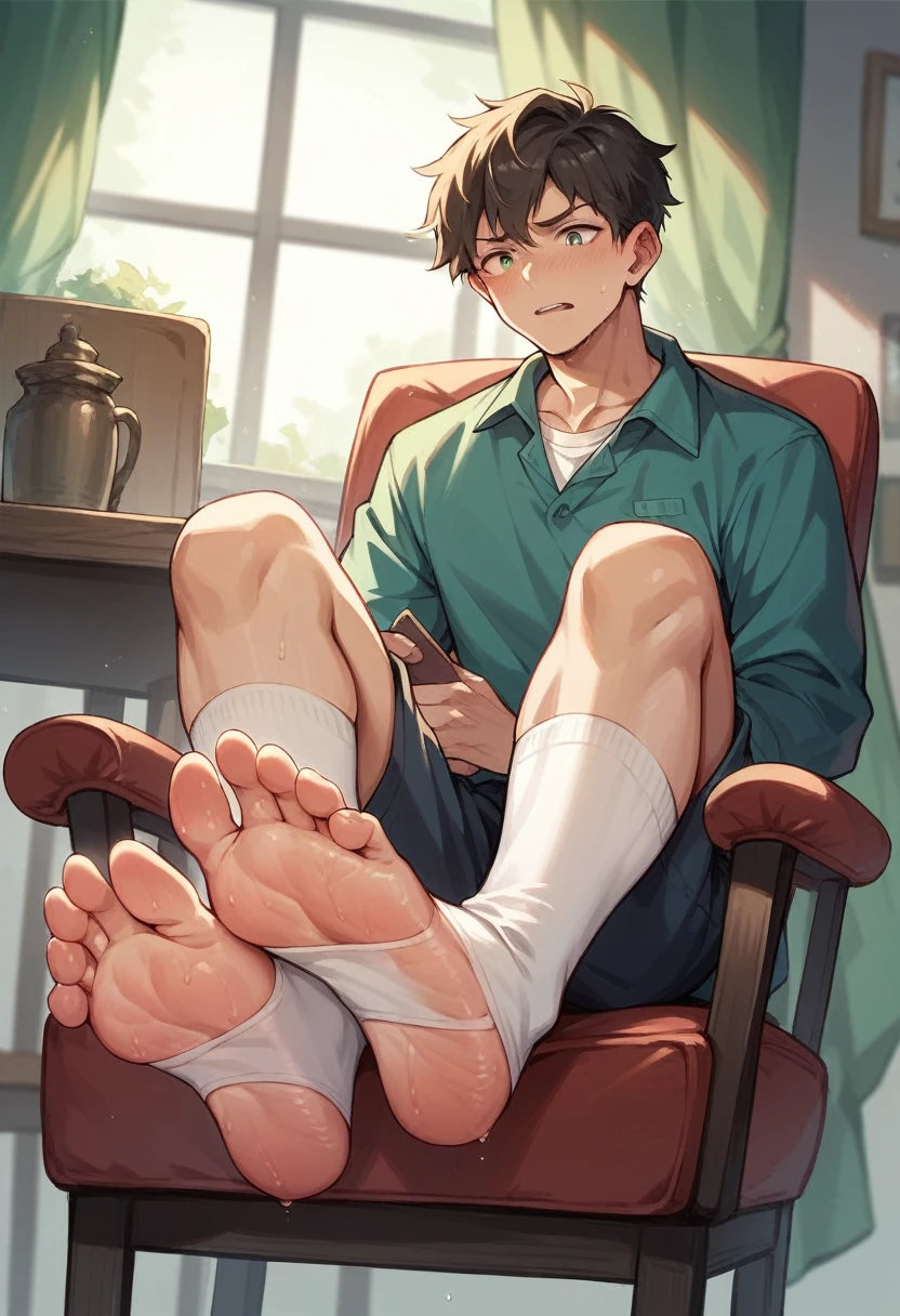 Boy showing the soles of his feet while scrunching his sweaty soles in white socks sitting on chair