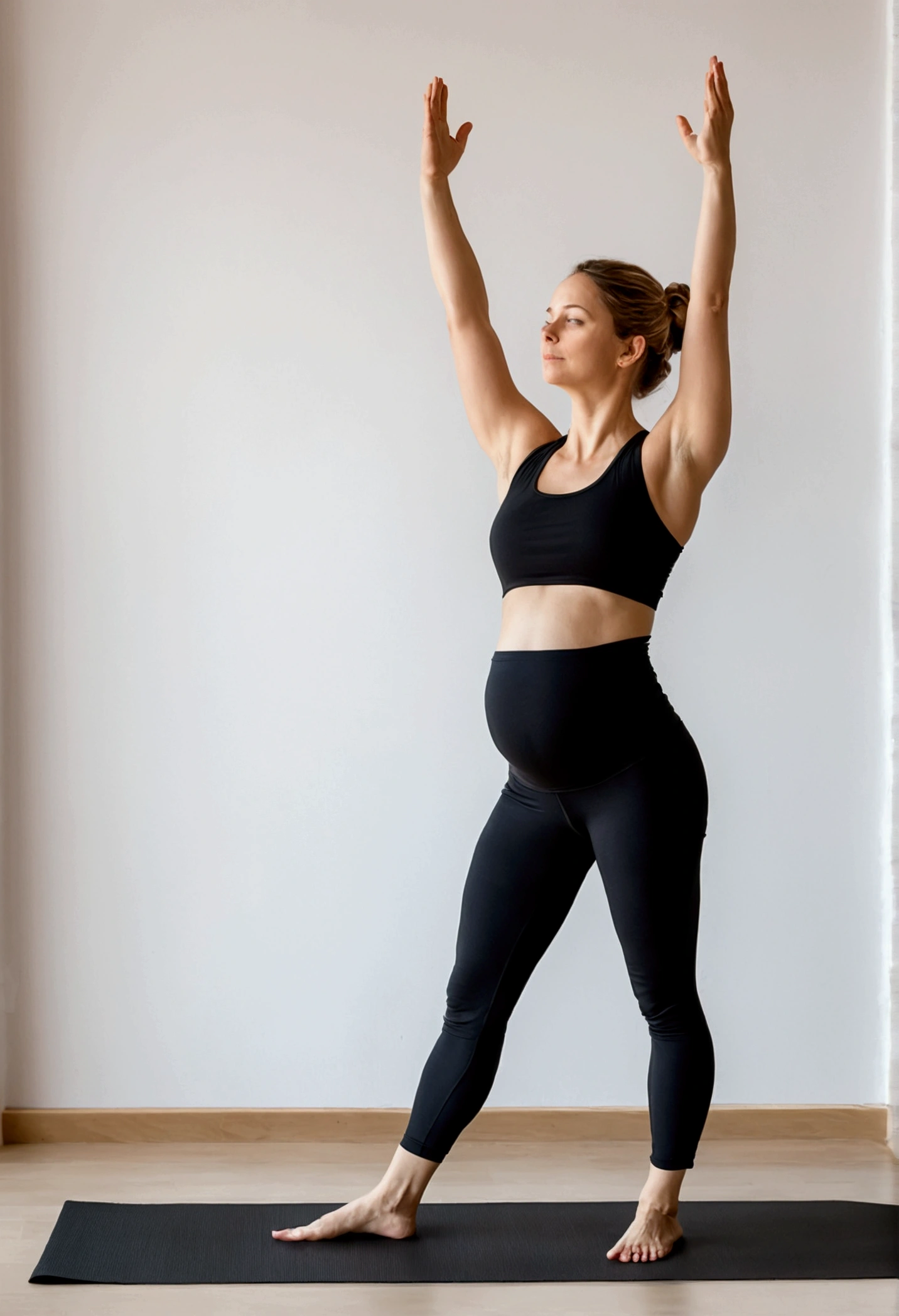 Yoga prenatal, Mountain Pose (Tadasana), photo superrealista, focus on full body yoga posture, a young woman between 24 to 27 years old pregnant in a black top and black pants, standing confidently and elegantly on a minimalist flat surface of white wall and black mat explaining Step 1 of Prenatal Yoga, Mountain Pose (Tadasana):“With feet together or slightly apart, distributing weight evenly". The posture is relaxed and natural, full front body concentrated in the posture, in prenatal yoga pose, with a touch of confident action in the style of Alina Ivanchenko and Anna Nikonova.