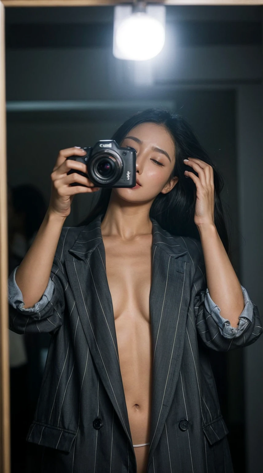 A korean woman takes a mirror selfie with a Canon EOS camera. The camera's flash illuminates the scene, creating a bright glare in the mirror. she has a pear body shape with an larged-size breast, She wears a bright red, vertically striped blazer with rolled-up sleeves, left open to reveal her bare larged-size breast. Her expression is serene, with her eyes slightly closed and her head tilted slightly to one side as she touches her hair with her other hand, messy wavy hair. The background appears dim, giving prominence to the subject in the foreground.