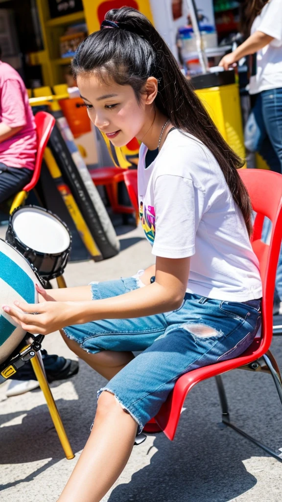 A low-angle photograph captures a young woman of mixed Thai and Chinese descent with long, straight black hair, sitting on a chair and playing a drum set. She is wearing a white t-shirt and short denim shorts. The woman is deeply focused on playing the drums. The background features a wall in a vibrant street art style, with distinctive designs that express emotions and bright colors, adding to the overall lively and dynamic atmosphere of the scene.