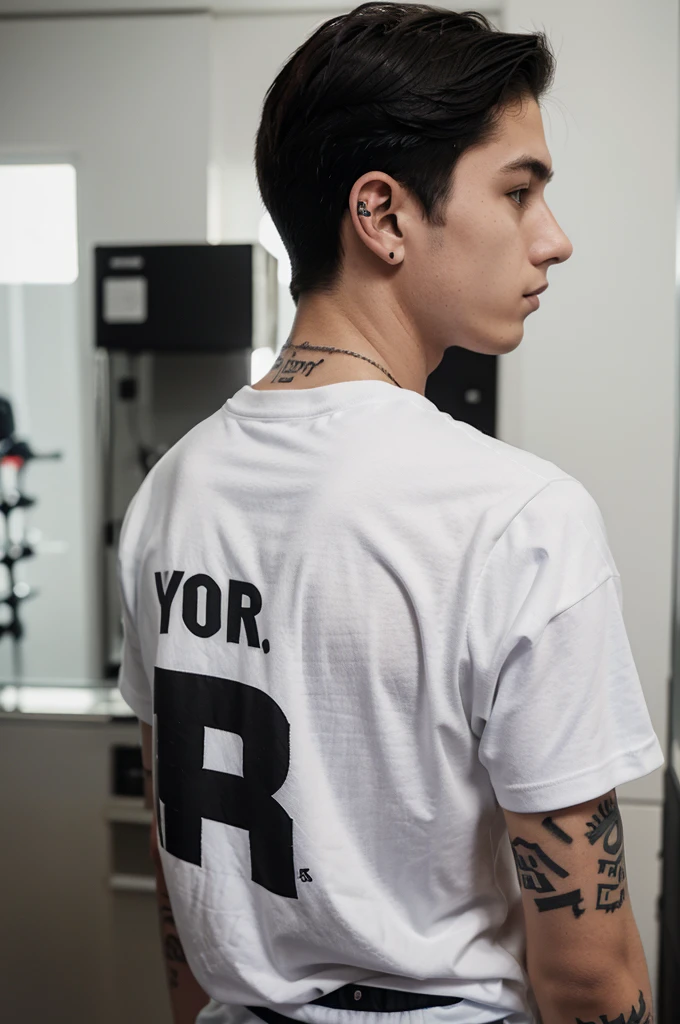 The 16 year old boy glanced to the right from behind. Black hair wearing white headphones with a tattoo on his neck. The back of the shirt has the words &#39;MUSA&#39; shining on it. night atmosphere