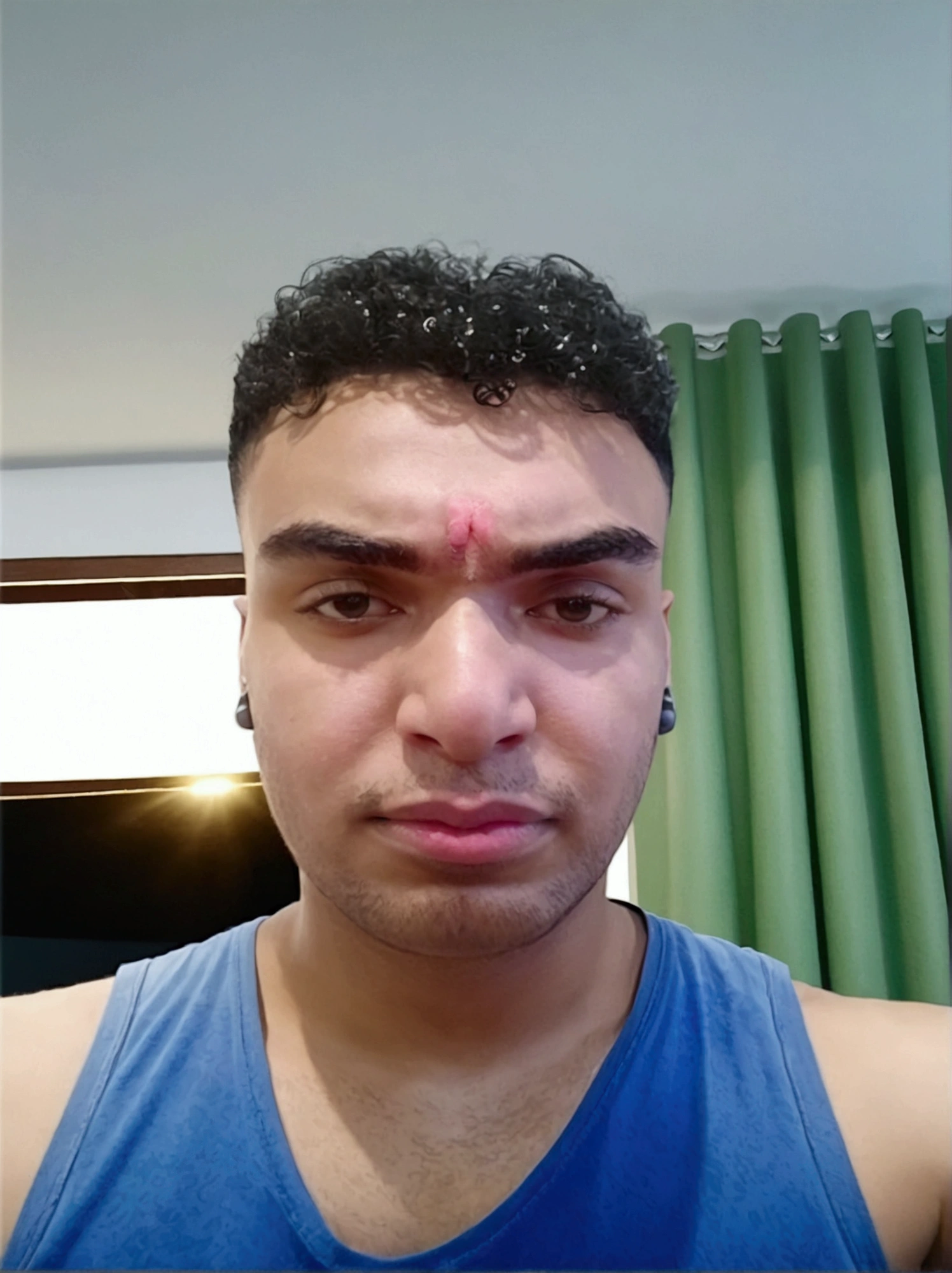 Youtuber headphones in front of computer  