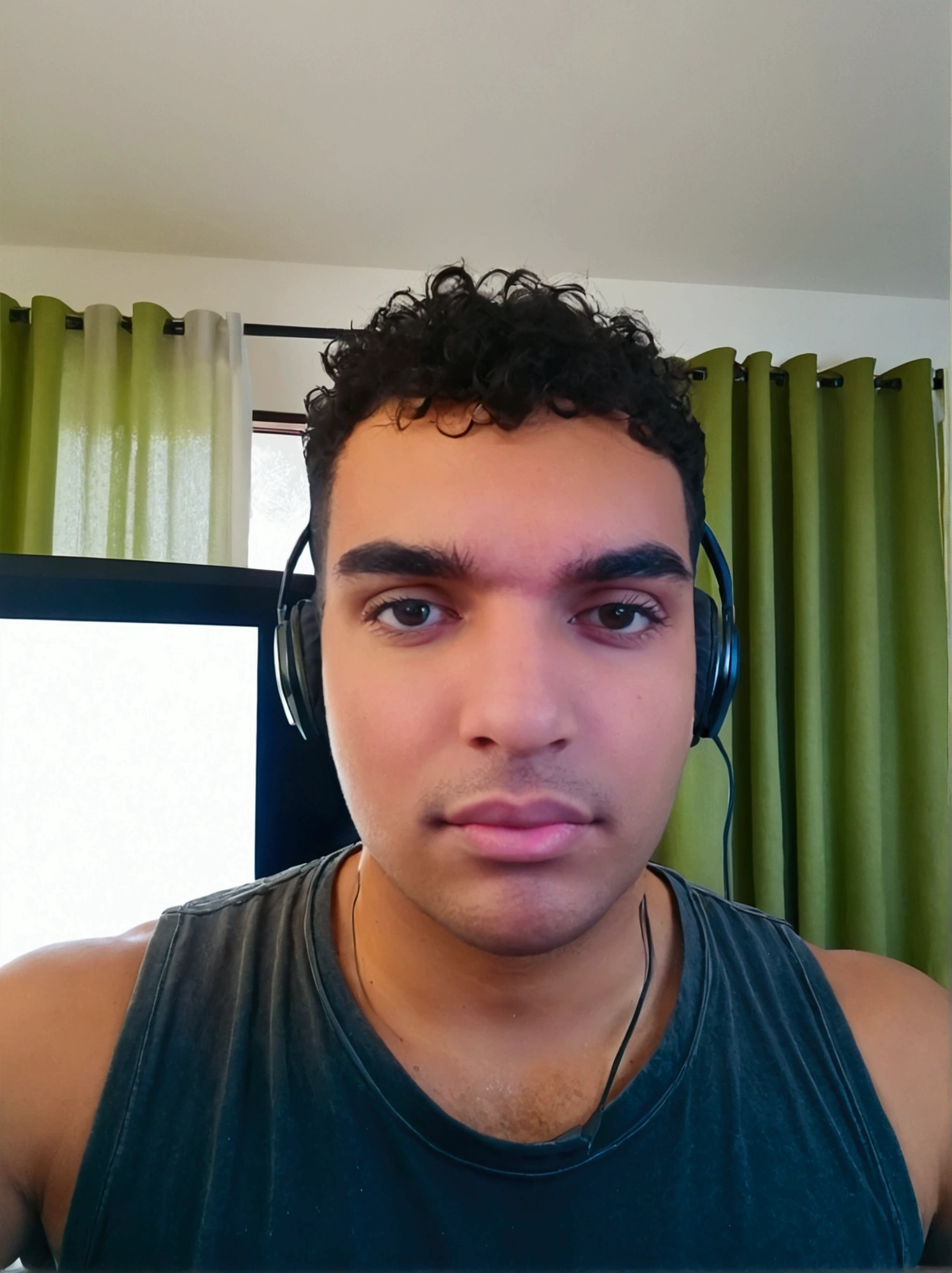 Youtuber headphones in front of computer