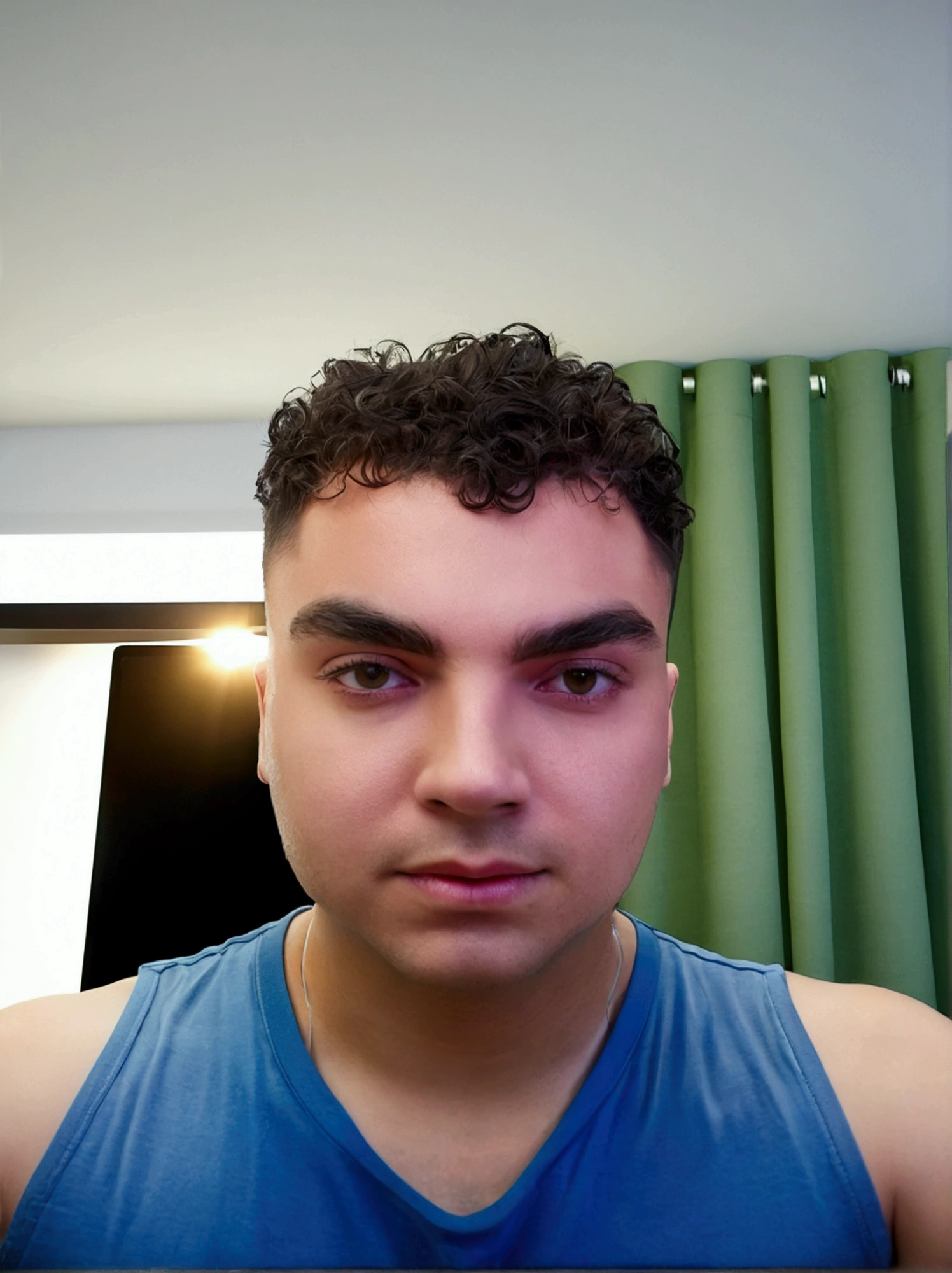 Youtuber headphones in front of computer  