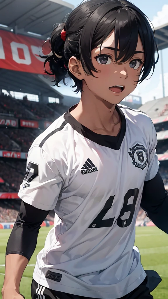 Young male football player with black hair, black eyes, he is celebrating, he is a football player for Manchester United.