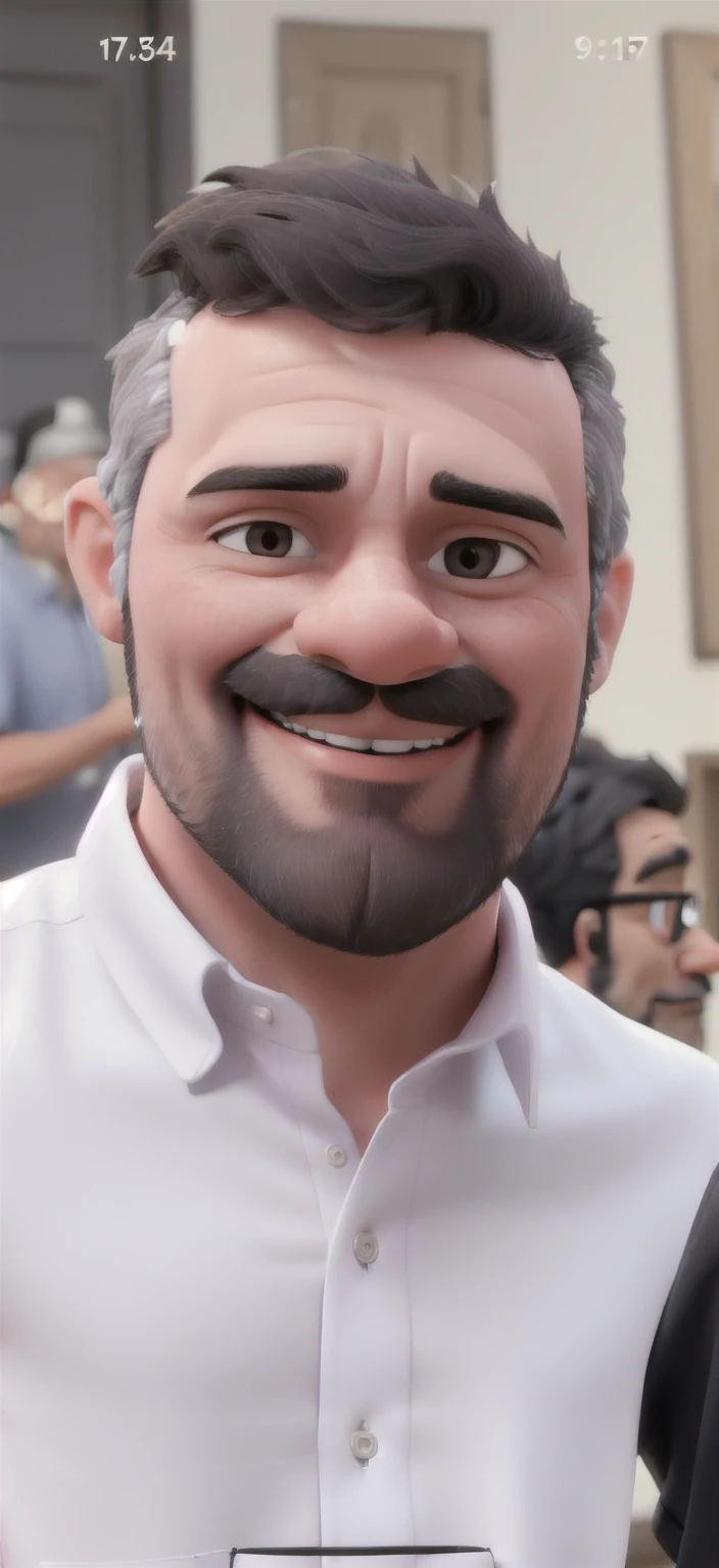 Man poses for photo. He wears a very light pink shirt, executive appearance. He has a sparse black beard with a few gray hairs.. The hair is black too, shorter on the sides and with few gray hairs, but predominantly black. He looks good and smiles in the photo.