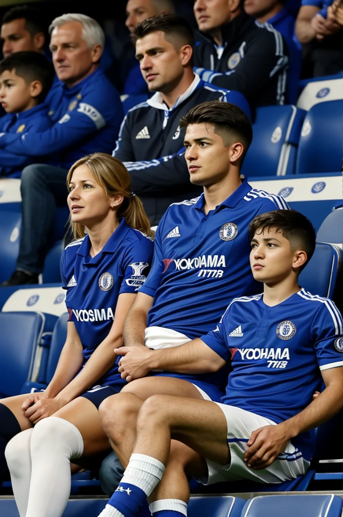 Chelsea FC fans, Father, mother and son watching the match at st stadium, son sits on dad&#39;s neck, they have the same Chelsea FC kit number 8, back view 