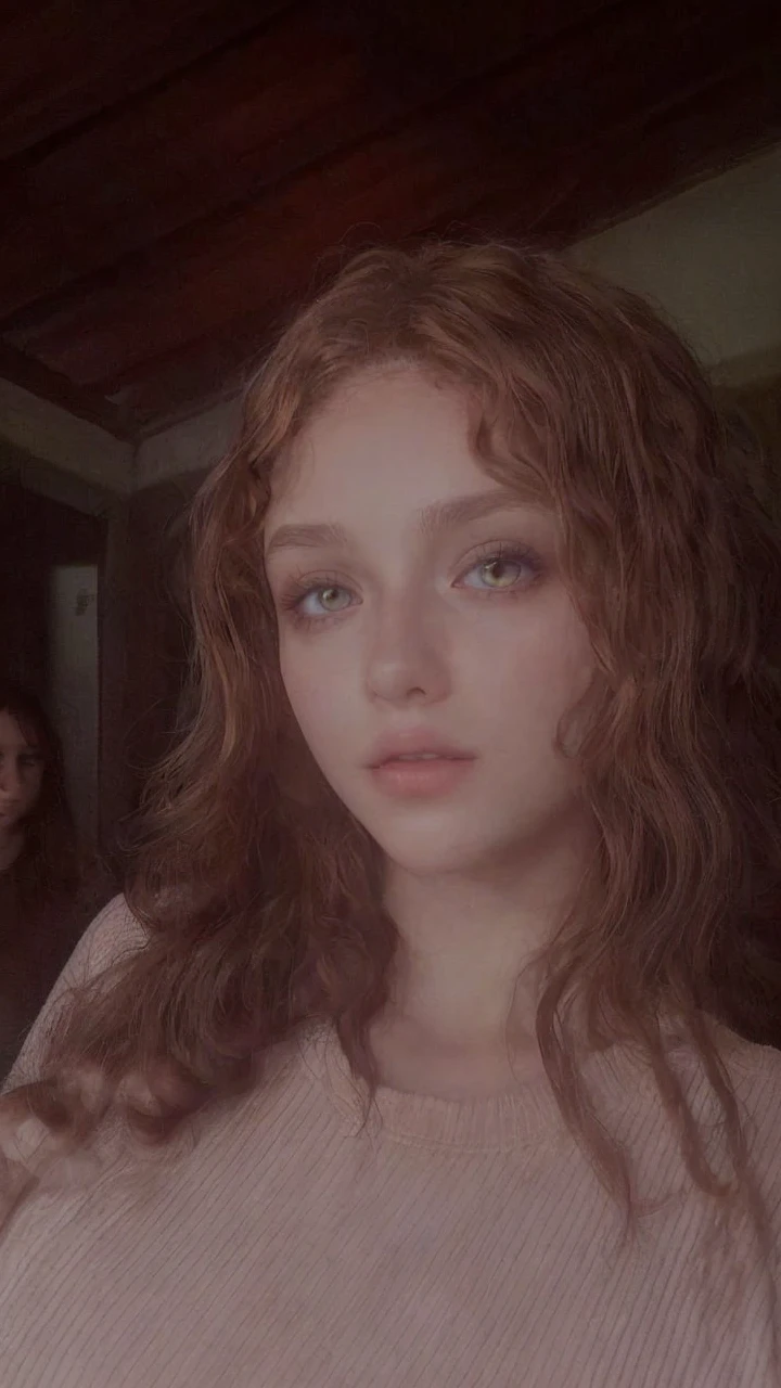Leave her with amber eyes, and curly hair 
