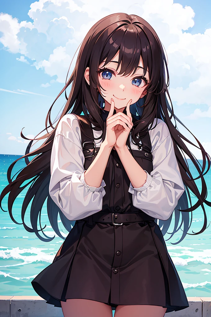 Cute girl makes a heart with her hands on her cheek and smiles.