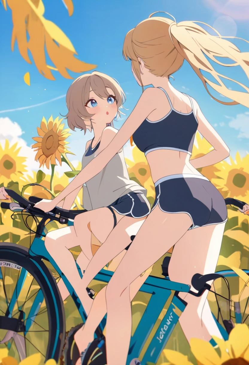 Two girls kiss while astride bicycles, dolphin shorts, sunflower field