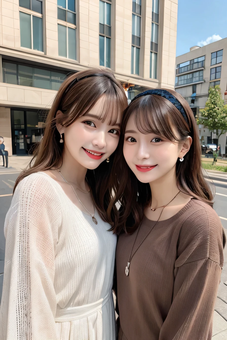 Highest quality, ,Two women standing side by side、smile、Beautiful teeth alignment、Light brown hair、Wavy Hair、hair band、Long sleeve blouse、ear piercing、necklace, ,、The background is the building's corridor.