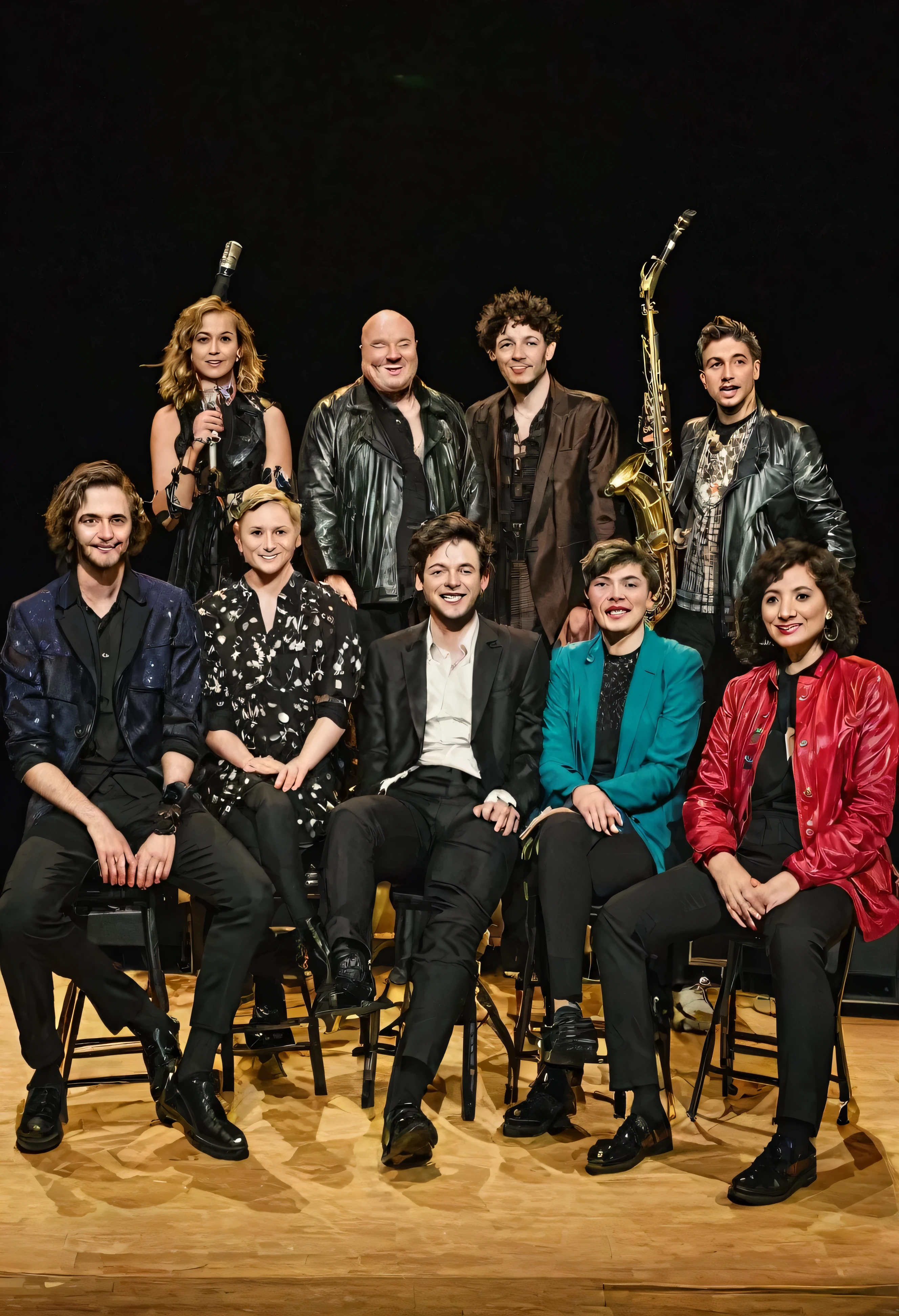 photo of a mixed group of musicians of 12 members on a stage
