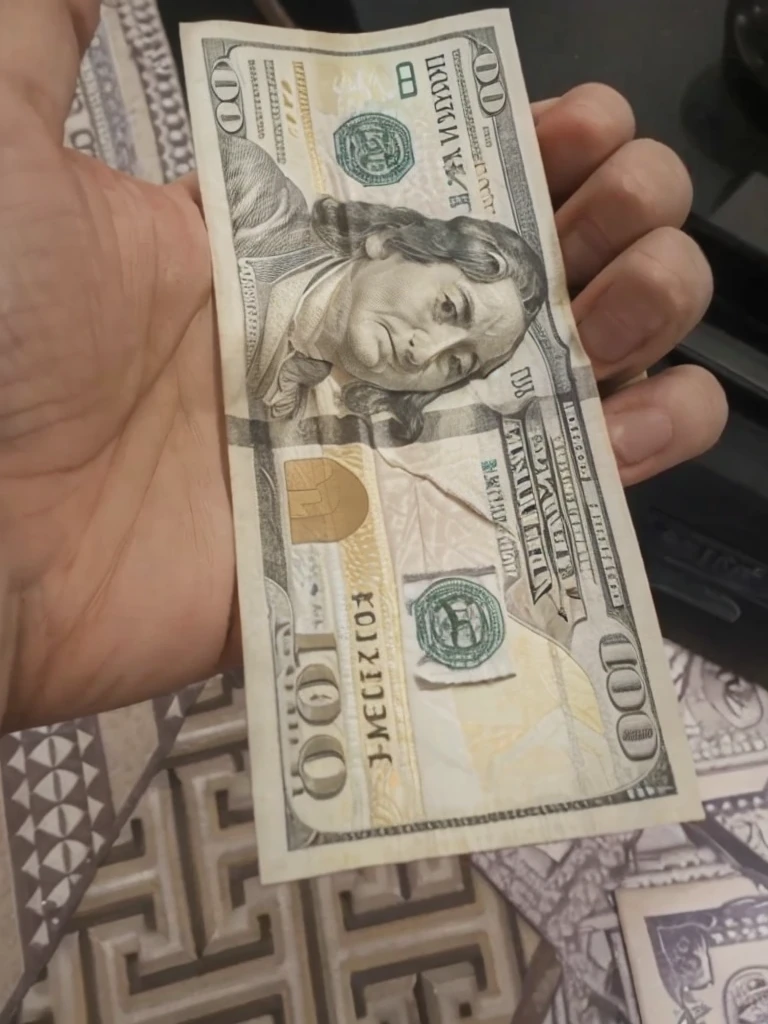 Convert this one 100 dollar bill to 50 bills but keep the background and everything else same