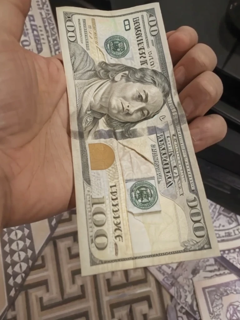 Convert this one 100 dollar bill to 50 bills but keep the background and everything else same